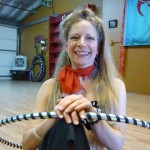 Che Rippinger of Hip The Hoopla humorous hoop dance fitness classes, performances and custom hoops